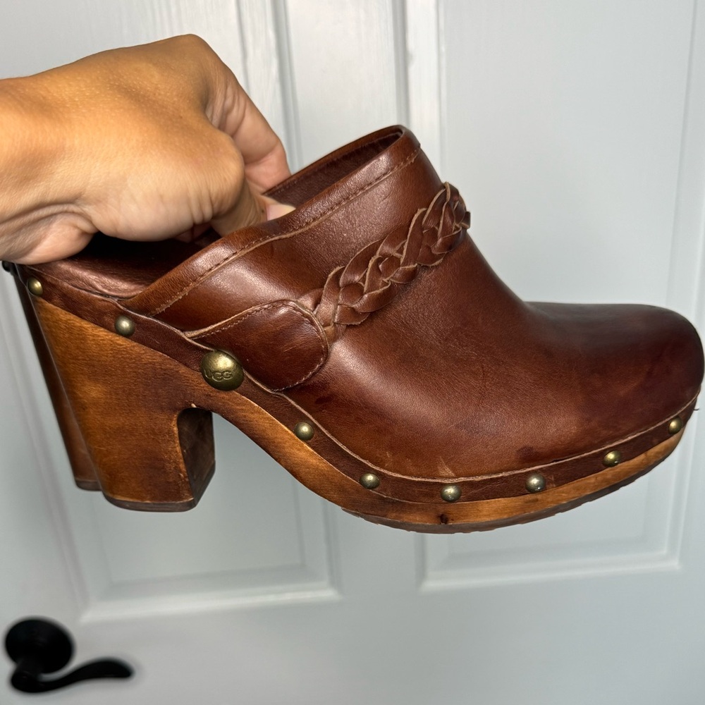 UGG Brown Clogs with wooden heel and shearling instep.